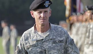 ** FILE ** This July 23, 2010, file photo shows Gen. Stanley McChrystal reviewing troops for the last time as he is honored at a retirement ceremony at Fort McNair in Washington. (AP Photo/J. Scott Applewhite, file)