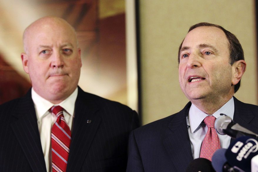 ** FILE ** In this Dec. 6, 2012, file photo, NHL Commissioner Gary Bettman, right, and deputy commissioner Bill Daly speak to reporters in New York. (AP Photo/Mary Altaffer, File)