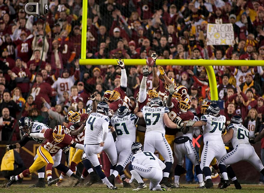 Seattle Seahawks kicker Steven Hauschka (4) makes an extra point in the second half against the Washington Redskins in the NFC wild card game at FedEx Field, Landover, Md., Sunday, January 6, 2013. (Craig Bisacre/The Washington Times)