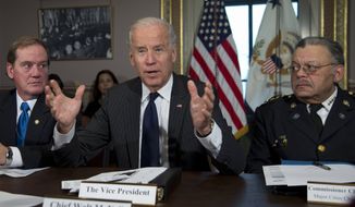 ** FILE ** Vice President Joe Biden, flanked by the president of the National Association of Police Organizations and Boston police officer, Thomas Nee, left, and president of the Police Executive Research Forum and Major Cities Chiefs Association and Philadelphia Police Commissioner Charles Ramsey, right, speaks during a meeting at the Eisenhower Executive Office Building in the White House complex, Thursday, Dec. 20, 2012, in Washington. Biden is leading a task force that will look at ways of reducing gun violence. (AP Photo/Carolyn Kaster)
