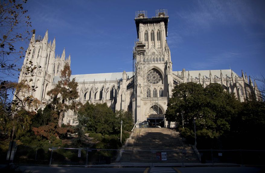 ** FILE ** Scaffolding is seen on the Washington National Cathedral in this Nov. 12, 2011, file photo taken before the consecration service of the first female Bishop of Washington, Rev. Mariann Edgar Budde. The Washington National Cathedral, where the nation gathers to mourn tragedies and celebrate new presidents, will soon begin performing same-sex marriages. It will announce its new policy Wednesday, Jan. 9, 2013. (AP Photo/Carolyn Kaster, File)