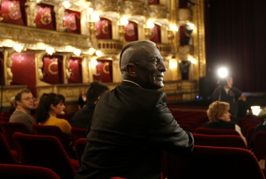 Classical music composer and presidential candidate Vladimir Franz smiles prior to a rehearsal of his opera "War with the Newts" at the State Opera in Prague, Czech Republic, Tuesday, Jan. 8, 2013. Franz is one of nine candidates running for President in the first round of the Czech Republic Presidential election on Jan. 11-12, 2013. (AP Photo/Petr David Josek)