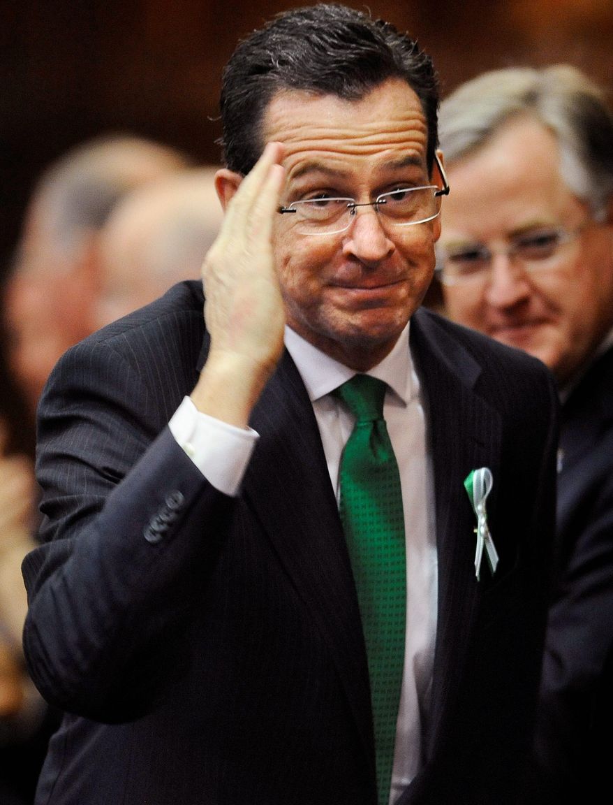 "When it comes to preventing future acts of violence in our schools, let me say this: More guns are not the answer. Freedom is not a handgun on the hip of every teacher, and security should not mean a guard posted outside every classroom," said Connecticut Gov. Dan Malloy. (Associated Press)