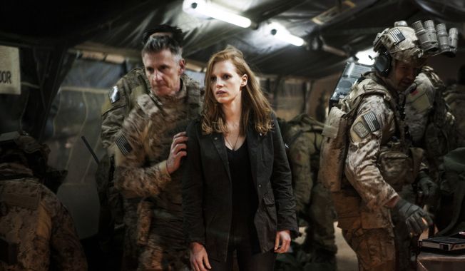 Jessica Chastain (center) plays a member of the elite team of spies and military operatives who secretly devote themselves to finding Osama Bin Laden in Columbia Pictures&#x27; new thriller, &quot;Zero Dark Thirty.&quot; (Associated Press/Columbia Pictures Industries, Inc.)
