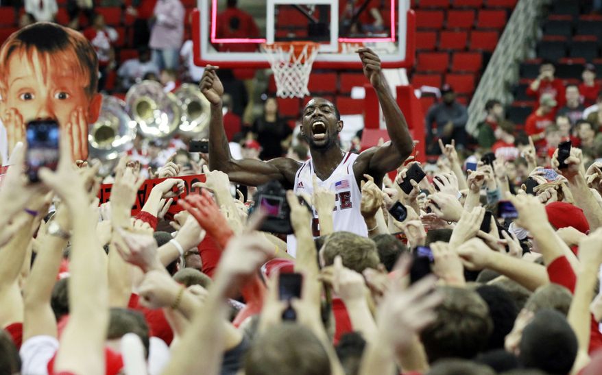 North Carolina State's C.J. Leslie (5) celebrates with the fans after the Wolfpack's 84-76 win over top-ranked Duke in Raleigh, N.C., Saturday, Jan. 12, 2013. (AP Photo/The News & Observer, Ethan Hyman)