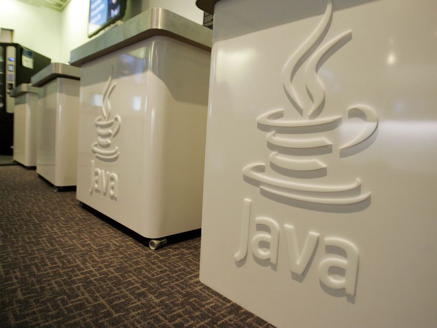 ** FILE ** This April 23, 2007, file photo shows the Java logo at Sun Microsystems' offices in Menlo Park, Calif. (AP Photo/Paul Sakuma, File)
