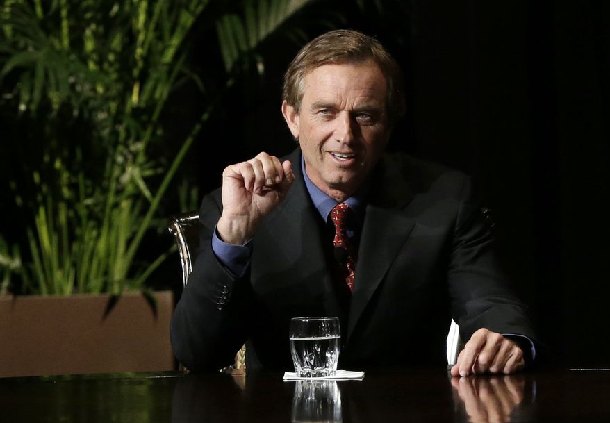 Robert F. Kennedy Jr., left, makes comments during the opening minutes of a interview with journalist Charlie Rose in front of a full audience at the AT&T Performing Arts Center Friday, Jan. 11, 2013, in Dallas, Texas. The Kennedys are in Dallas as a year of observances begins for the 50th anniversary of President John F. Kennedy's assassination. (AP Photo/Tony Gutierrez)
