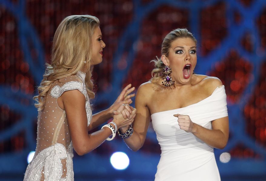Miss New York Mallory Hagan (right), with Miss South Carolina Ali Rogers, reacts as she is named Miss America 2013 on Saturday, Jan. 12, 2013, in Las Vegas. (AP Photo/Isaac Brekken)