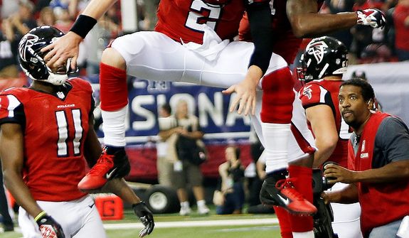 Atlanta Falcons fullback Jason Snelling (44) celebrates his touchdown run with quarterback Matt Ryan (2) during the second half of an NFC divisional playoff NFL football game against the Seattle Seahawks Sunday, Jan. 13, 2013, in Atlanta. (AP Photo/John Bazemore)