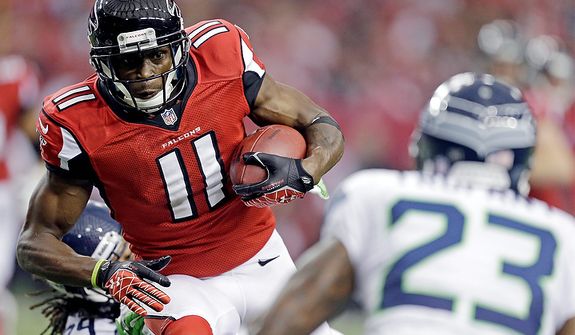 Atlanta Falcons wide receiver Julio Jones (11) works against Seattle Seahawks cornerback Marcus Trufant (23) during the first half of an NFC divisional playoff NFL football game Sunday, Jan. 13, 2013, in Atlanta. (AP Photo/David Goldman)