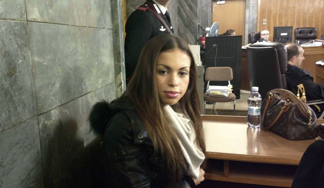 Karima el-Mahroug, the Moroccan woman at the center of ex-Italian Premier Silvio Berlusconi&#x27;s sex-for-hire trial, sits in a courtroom in Milan on Monday, Jan. 14, 2013. (AP Photo/Luca Bruno)