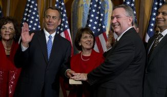 **FILE** Rep. Steve Stockman (second from right), Texas Republican, participates in a mock swearing-in ceremony with Speaker of the House Rep. John Boehner, Ohio Republican, for the 113th Congress in Washington on Jan. 3, 2013. (Associated Press)