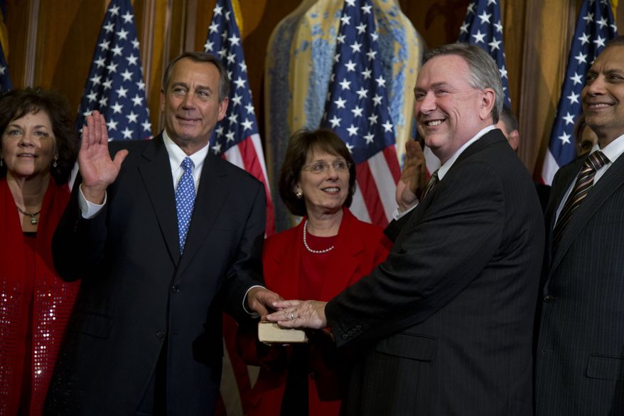 **FILE** Rep. Steve Stockman (second from right), Texas Republican, participates in a mock swearing-in ceremony with Speaker of the House Rep. John Boehner, Ohio Republican, for the 113th Congress in Washington on Jan. 3, 2013. (Associated Press)