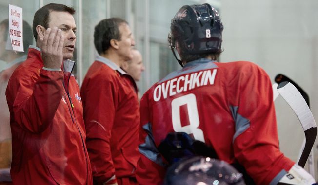 Capitals coach Adam Oates (left) talks with left wing Alex Ovechkin on Tuesday during a scrimmage against the Reading Royals at Kettler Capitals Iceplex. (Andrew Harnik/The Washington Times)