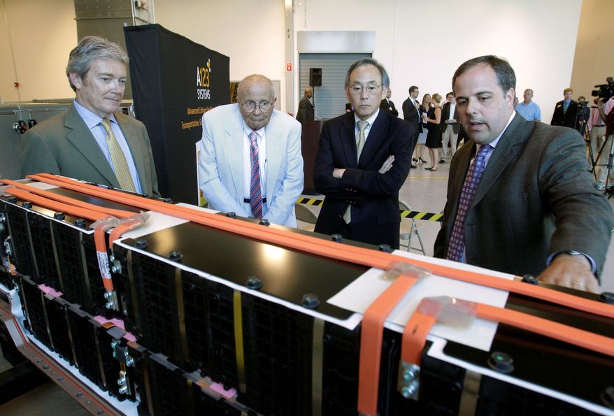 Jason Forcier (right), vice president and general manager of A123 Systems Inc., shows off a lithium-ion battery at a plant in Romulus, Mich., in 2011 to (from left) A123 President and CEO David Vieau, Rep. John D. Dingell, Michigan Democrat, and Energy Secretary Steven Chu. Now in bankruptcy, the pending sale of A123 to a China-based company has vendors and stockholders trying to recoup some of they money they have lost. (Associated Press)