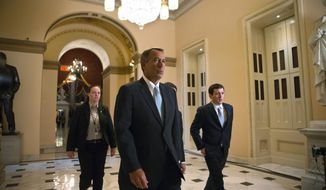 House Speaker John A, Boehner, Ohio Republican, walks to the House chamber on Capitol Hill in Washington on Jan. 15, 2013, as lawmakers debate the details of an emergency spending package to assist victims of Superstorm Sandy that devastated parts of the Northeast coast in October. (Associated Press)