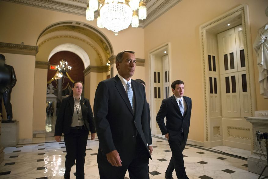House Speaker John A, Boehner, Ohio Republican, walks to the House chamber on Capitol Hill in Washington on Jan. 15, 2013, as lawmakers debate the details of an emergency spending package to assist victims of Superstorm Sandy that devastated parts of the Northeast coast in October. (Associated Press)