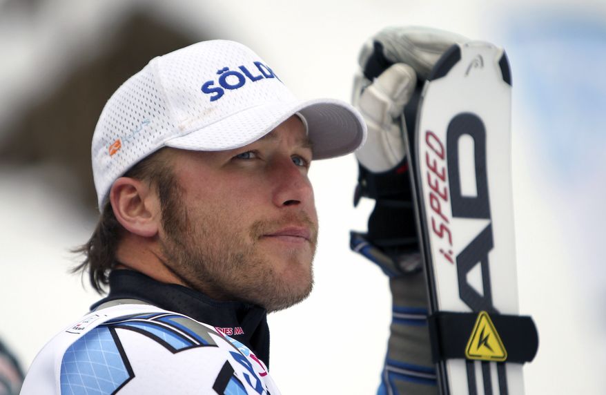 FILE - In this Jan. 13, 2012 file photo, Bode Miller, of the United States, looks at the scoreboard after finishing third in a alpine ski, men's World Cup super-combined, in Wengen, Switzerland. Miller will skip the rest of the World Cup season to rest his surgically repaired left knee.The two-time overall champion had microfracture surgery nearly a year ago and has been taking a cautious approach to recovery, not wanting any sort of setback with the Sochi Games just a year away. (AP Photo/Marco Trovati, File)