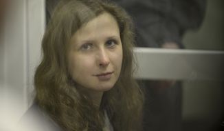 Jailed feminist punk band Pussy Riot member Maria Alekhina is seen in a cell at a courtroom in Berezniki, about 1,500 km (940 miles) northeast of Moscow on Jan. 16, 2013. A Russian court on Wednesday turned down her attempt to defer serving her sentence until her preschool son becomes a teenager. Alekhina was convicted last year along with two other band members of hooliganism motivated by religious hatred for an anti-President Vladimir Putin stunt in Russia&#39;s main cathedral. (Associated Press)