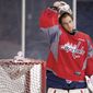 Capitals goaltender Braden Holtby recorded a 1.95 goals against average and a .935 save percentage in 14 playoff games last year. The 23-year-old is competing with Michal Neuvirth for the starting spot to open the lockout-shortened 48-game regular season. (Andrew Harnik/The Washington Times)