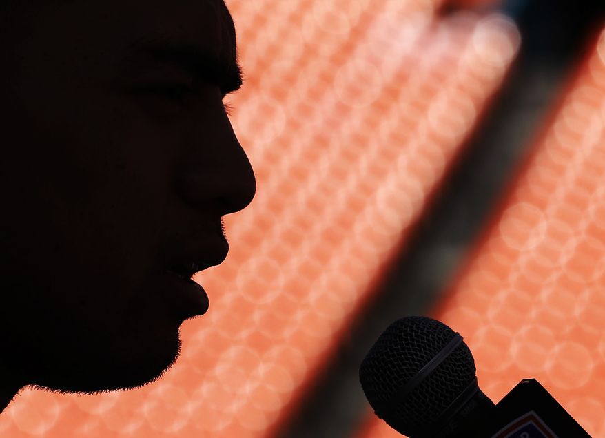 ** FILE ** In this Jan. 5, 2013, file photo, Notre Dame linebacker Manti Te'o answers a question during media day for the BCS national championship NCAA college football game in Miami. A story that Te'o's girlfriend had died of leukemia _ a loss he said inspired him to help lead the Irish to the BCS championship game _ was dismissed by the university Wednesday, Jan. 16, as a hoax perpetrated against the linebacker. (AP Photo/David J. Phillip)