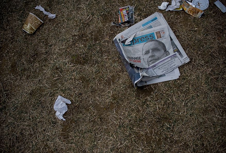 Trash litters the ground after the crowds being to dissipate from around the Washington Monument on inauguration day on the National Mall in Washington D.C., Tuesday, Jan. 20, 2009. (Allison Shelley / The Washington Times)
