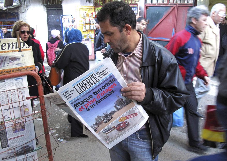 A man reads a newspaper headlining "Terrorist attack and kidnapping in In Amenas," at a newsstand in Algiers, Thursday, Jan. 17, 2013. Algerian forces raided a remote Sahara gas plant on Thursday in an attempt to free dozens of foreign hostages held by militants with ties to Mali’s rebel Islamists, diplomats and an Algerian security official said. (AP Photo/Ouahab Hebbat)