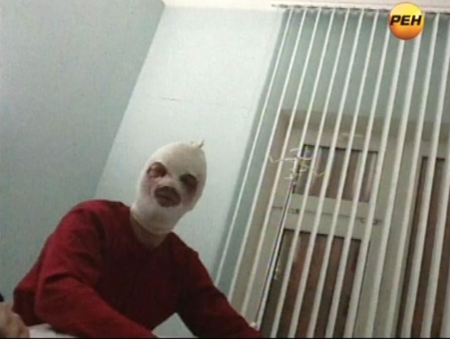 In this video grab provided by RenTV via APTN, artistic director of the Bolshoi ballet Sergei Filin gestures in a hospital in Moscow, Friday, Jan. 18, 2013, where he is being treated. Filin, a 42-year-old former Bolshoi star, said a man threw the acid into his face late Thursday near the gate of his apartment building in central Moscow. (AP Photo/RenTV) TV OUT