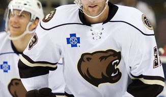 Tom Poti celebrates scoring for the American Hockey League’s Hershey Bears on Jan. 13 vs. the Connecticut Whale. On Saturday, Poti played in his first NHL game in almost two years, skating 19 shifts for the Capitals in a season-opening 6-3 loss to Tampa Bay. (Associated Press)