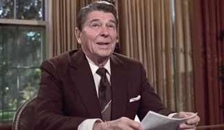 ** FILE ** “We must act today in order to preserve tomorrow,” President Reagan said during his first inaugural address, Jan. 20, 1981. (Associated Press)