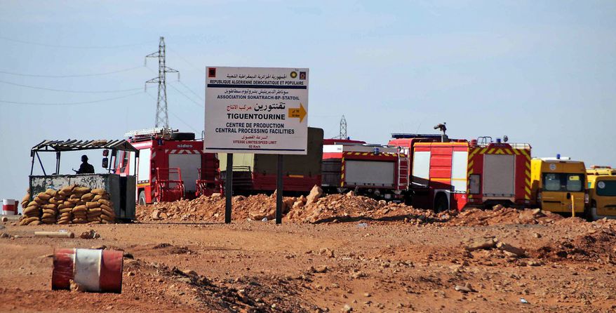 Rescue vehicles swarm the gas plant where al Qaeda-linked terrorists held hundreds of people hostage. An Algerian military assault Saturday ended with the deaths of at least 23 hostages, including an American, and 32 heavily armed kidnappers. (Associated Press)