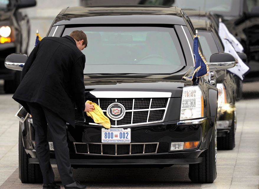 President Obama's armored limousine is polished up with a new license plate after his arrival at the U.S. Capitol for his inauguration on Monday, Jan. 21, 2013. (Associated Press)