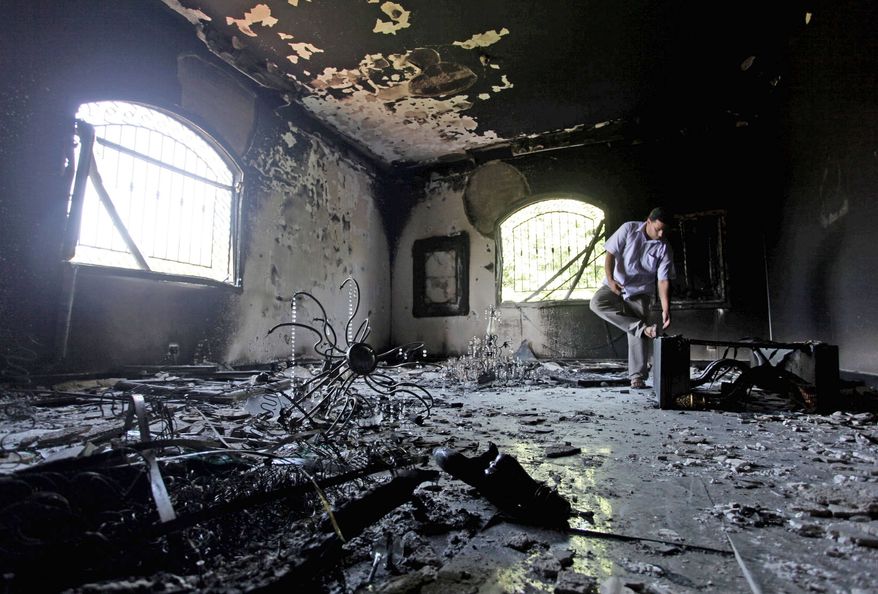 A Libyan man walks inside the U.S. Consulate in Benghazi, Libya, two days after the attack that left Ambassador J. Christopher Stevens and three other Americans dead on Sept. 11. Republicans are seeking answers to lingering questions about the attack from Secretary of State Hillary Rodham Clinton this week. (Associated Press)