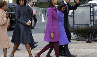 President Obama waves as he walks to St. John&#x27;s Episcopal Church with (from left) his his mother-in-law, Marian Robinson; first lady Michelle Obama; and the Obamas&#x27; daughters, Malia and Sasha, on Monday, Jan. 21, 2013, in Washington. (AP Photo/Jacquelyn Martin)