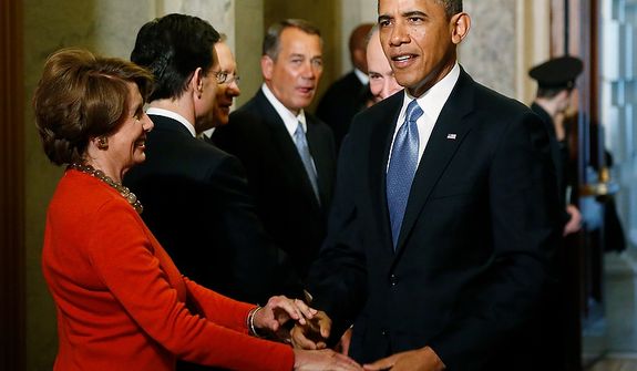 U.S. President Barack Obama (R) greets House Minority Leader Nancy Pelosi (D-CA) (L) as he arrives at the senate carriage entrance for swearing-in ceremonies at the U.S Capitol in Washington, January 21, 2013.   REUTERS/Jonathan Ernst   