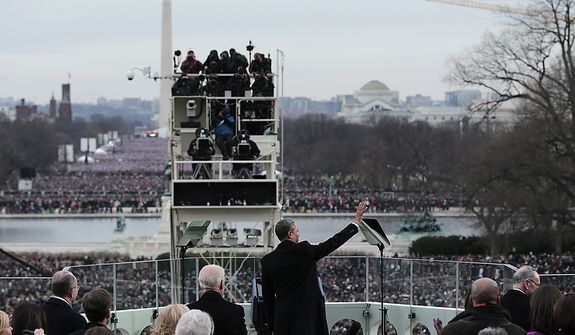 U.S. President Barack Obama waves during the public ceremonial inauguration on the West Front of the U.S. Capitol January 21, 2013 in Washington, DC.   Barack Obama was re-elected for a second term as President of the United States.  (Photo by POOL Win McNamee/Getty Images)