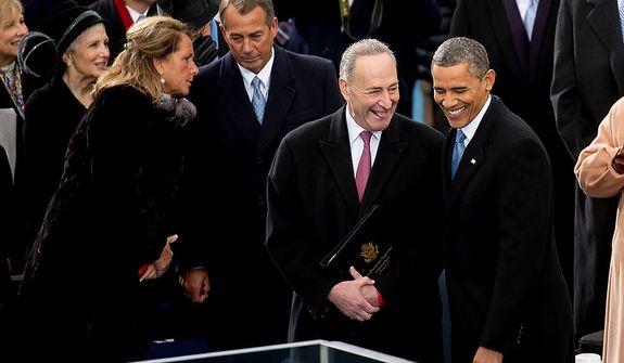 President Barack Obama talks with Sen. Charles E. Schumer (D-N.Y.) before being sworn in for his second term on the West Lawn of the U.S. Capitol Building at the 57th Presidential Inauguration Ceremony, Washington, D.C., Monday, January 21, 2013. (Andrew Harnik/The Washington Times)