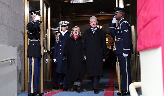 U.S. Secretary of State Hillary Clinton and former U.S. President Bill Clinton arrive during the presidential inauguration on the West Front of the U.S. Capitol January 21, 2013 in Washington, DC.   Barack Obama was re-elected for a second term as President of the United States.  (Photo by POOL Win McNamee/Getty Images)