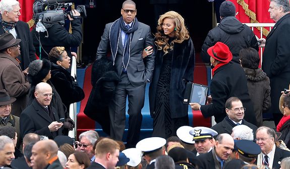 Beyonce and Jay-Z arrive at the ceremonial swearing-in for President Barack Obama at the U.S. Capitol during the 57th Presidential Inauguration in Washington, Monday, Jan. 21, 2013. (AP Photo/Scott Andrews, Pool) 