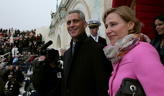 Chicago Mayor Rahm Emanuel and wife Amy Rule arrive before the presidential inauguration on the West Front of the U.S. Capitol January 21, 2013 in Washington, DC.   Barack Obama was re-elected for a second term as President of the United States.  (Photo by POOL Win McNamee/Getty Images)