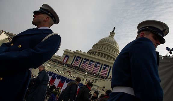 Members of the military stand on hand on the West Lawn of the U.S. Capitol Building before President Barack Obama is sworn in for his second term at the 57th Presidential Inauguration Ceremony, Washington, D.C., Monday, January 21, 2013. (Andrew Harnik/The Washington Times)