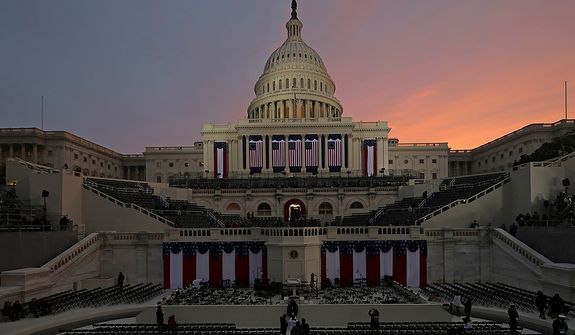 The sunrises early in the morning before the ceremonial swearing-in of President Barack Obama at the U.S. Capitol during the 57th Presidential Inauguration in Washington, Monday, Jan. 21, 2013. (AP Photo/Scott Andrews, Pool) 