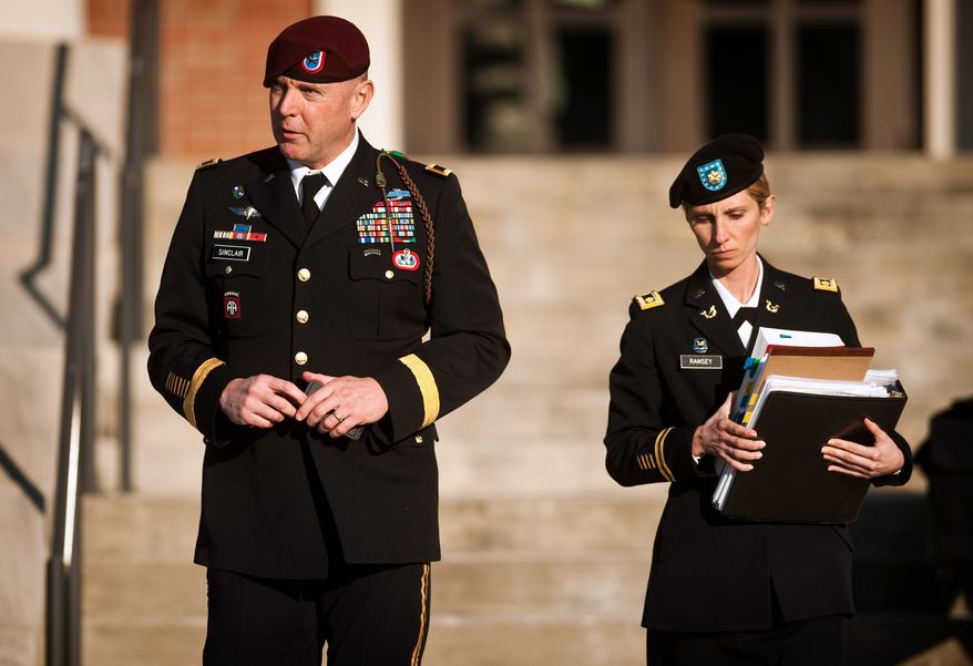 Army Brig. Gen. Jeffrey A. Sinclair (left) leaves a Fort Bragg courthouse with a member of his defense team, Maj. Elizabeth Ramsey, on Jan. 22, 2012, after he deferred entering a plea at his arraignment on charges of fraud, forcible sodomy, coercion and inappropriate relationships. Sinclair, who served five combat tours, is headed to trial following a spate of highly publicized military sex scandals involving high-ranking officers that has triggered a review of ethics training across the service branches. (Associated Press/The Fayetteville Observer)