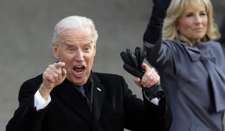 **FILE** Vice President Joseph R. Biden reacts Jan. 21, 2013, with his wife, Jill, as they walk down Pennsylvania Avenue en route to the White House during the 57th presidential inauguration parade after the ceremonial swearing-in of President Obama. (Associated Press)