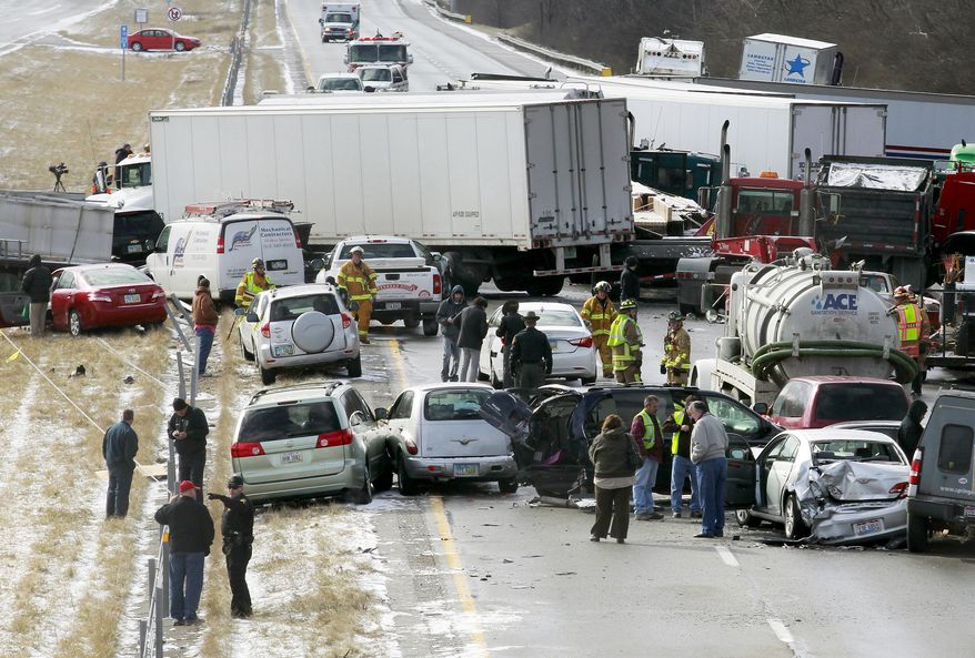 Semi-trucks and other vehicles involved in a multi-car crash are strewn across westbound Interstate 275 between Colerain Avenue and Hamilton Avenue on Jan. 21, 2013, in Cincinnati. The accident left about 20 people injured. (Associated Press)