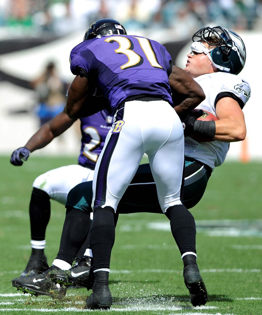 Baltimore's Bernard Pollard (31) has made a name for
himself with big hits — like this one on Philadelphia's Brent Celek earlier this season. (Associated Press)