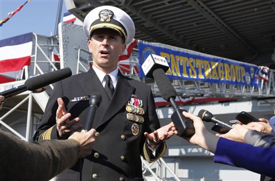 ** FILE ** Adm. Jonathan Greenert, chief of naval operations, gestures as he address the media in front of the USS Enterprise at Naval Station Norfolk on Saturday, Dec. 1, 2012, in Norfolk, Va., before an inactivation ceremony for the Enterprise, the first nuclear-powered aircraft carrier. The ship served in the fleet for 51 years. (AP Photo/Steve Helber)