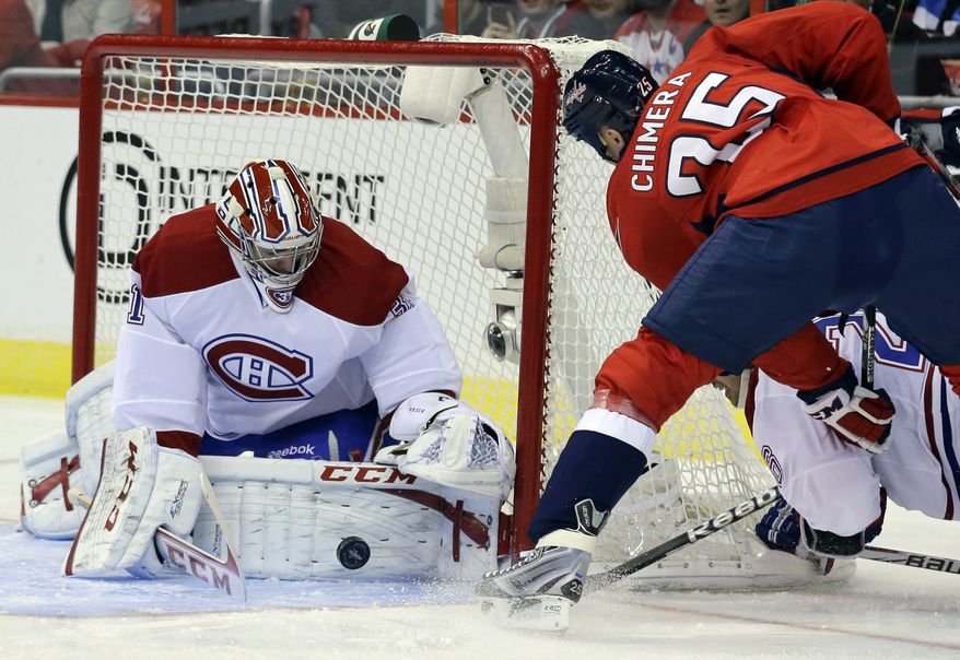 Montreal Canadiens goalie Carey Price (31) blocks a shot by Washington Capitals left wing Jason Chimera (25) in the first period of an NHL hockey game on Thursday, Jan. 24, 2013, at the Verizon Center in Washington. (AP Photo/Alex Brandon)