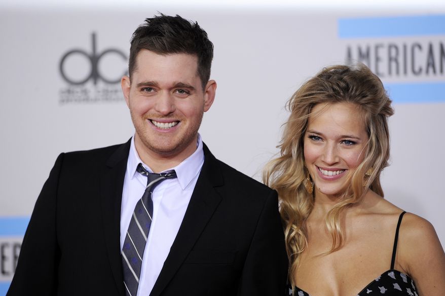Singer Michael Buble and actress-model Luisana Lopilato attend the 38th annual American Music Awards in Los Angeles in 2010. The duo, who were married in 2011, are expecting their first baby. (AP Photo/Chris Pizzello)