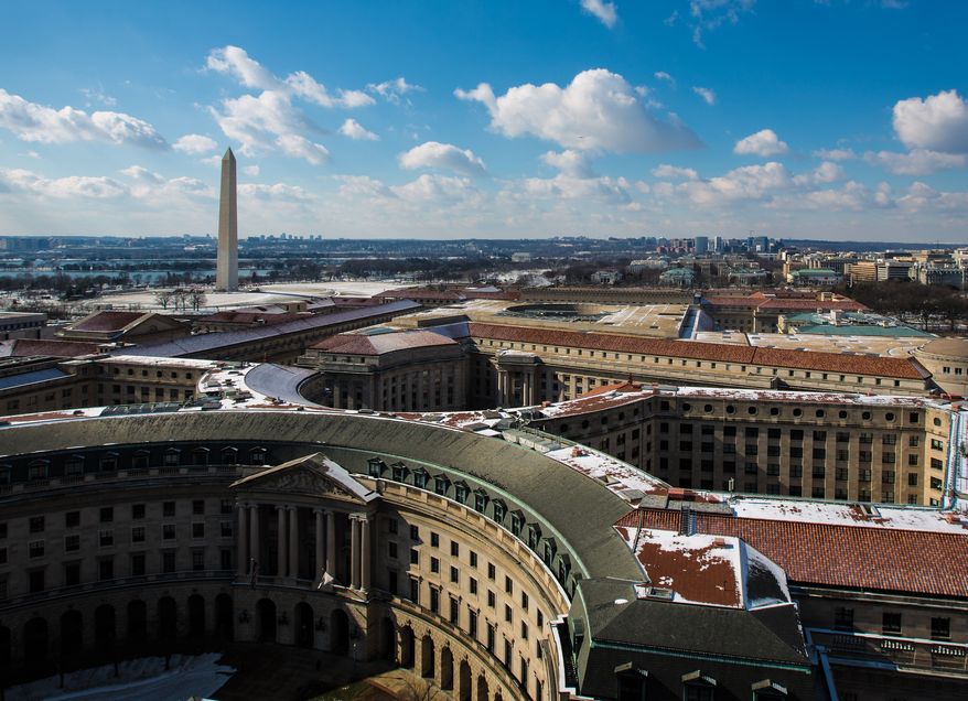 The D.C. landscape is transformed as roof tops and streets are dusted with the first snow fall of year, in Washington, D.C., Thursday, Jan. 24, 2013. (Andrew S. Geraci/The Washington Times)